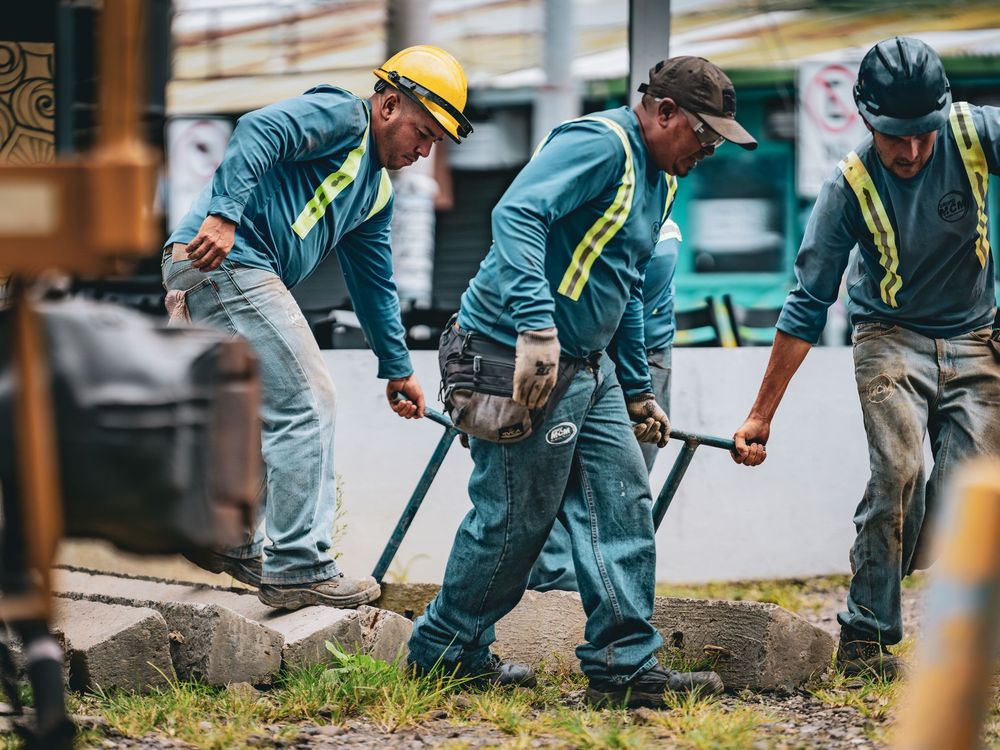 Construction workers on site in safety gear